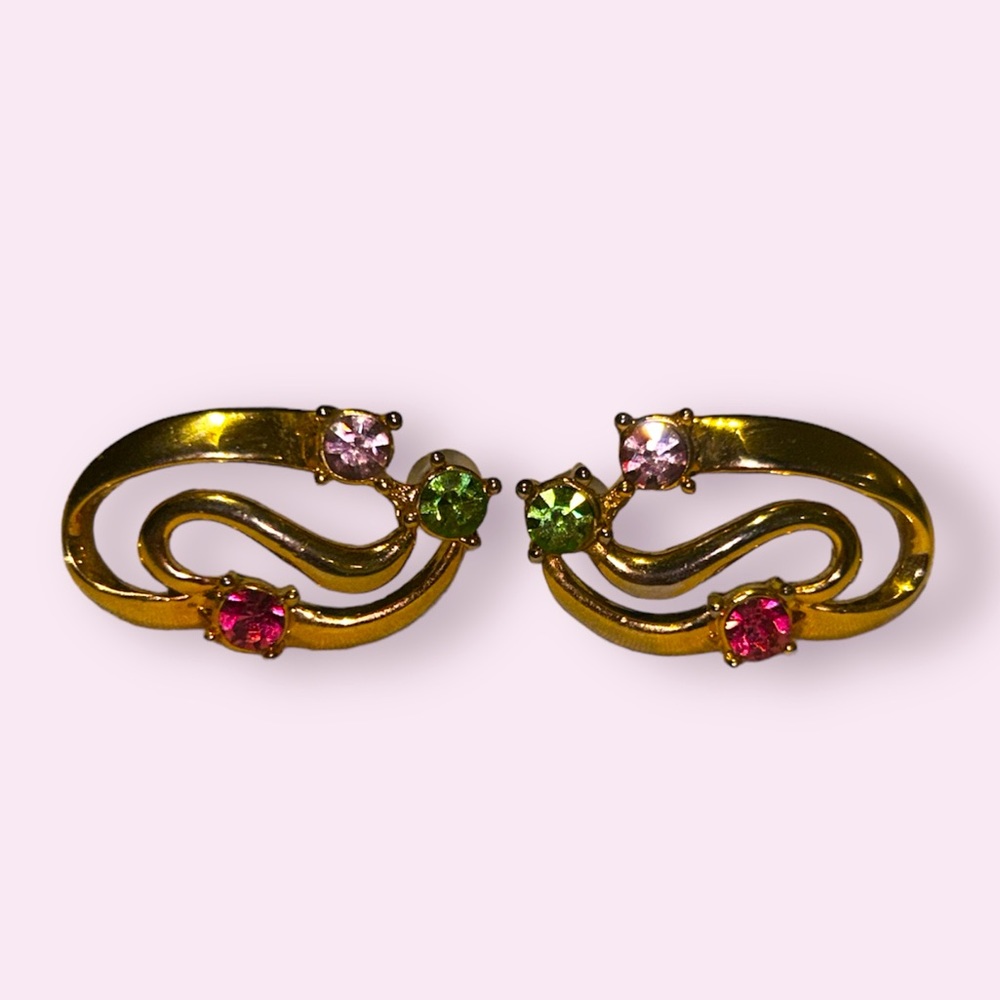 Gold earrings with rhinestones.